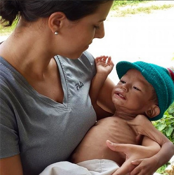 Child in the Arms of Rescuer