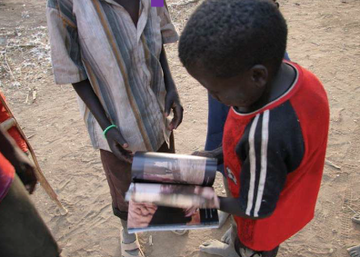 Boy Holding a Magazine